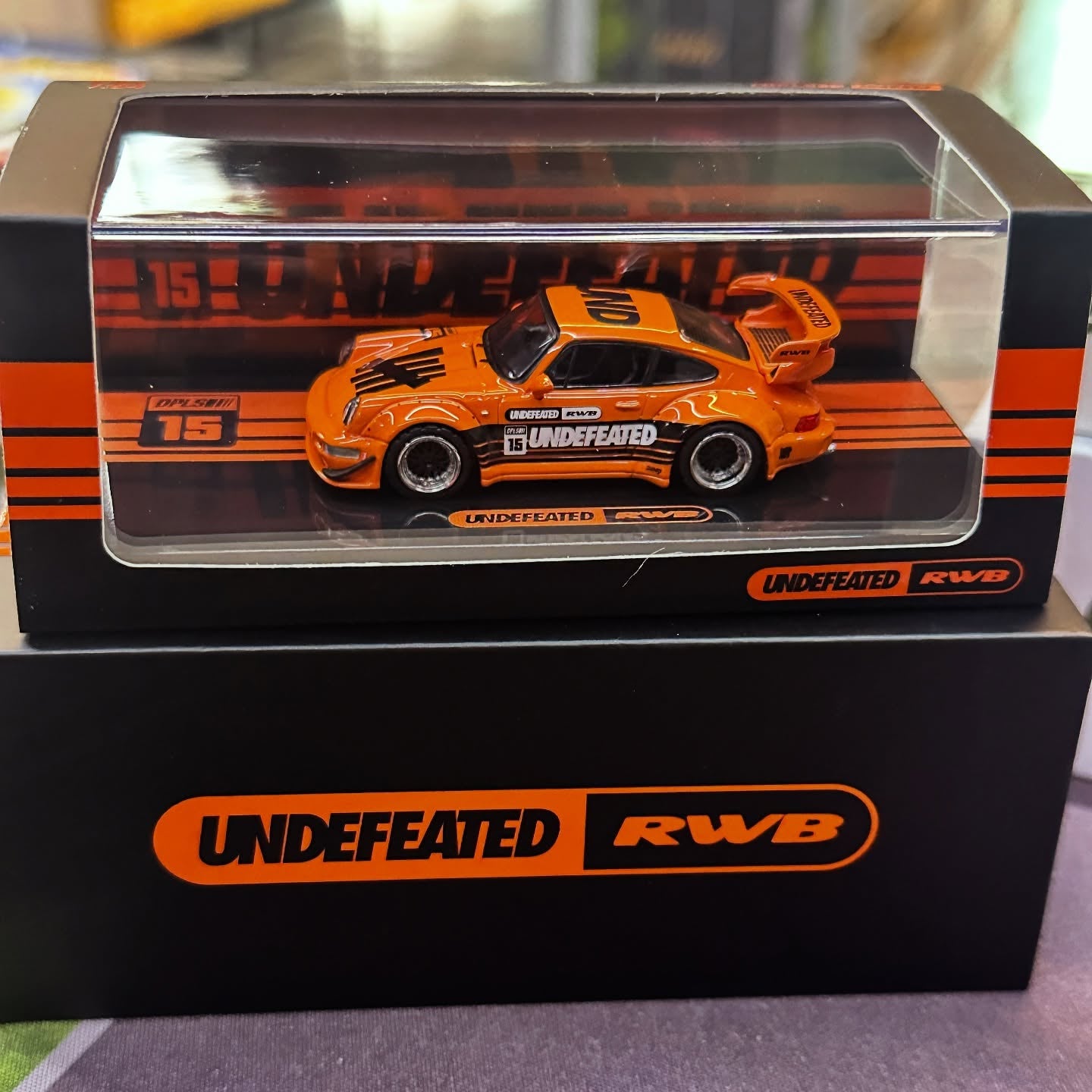 INNO64 x DPLS 1/64 Porsche 964 RWB Undefeated RAUH-Welt BEGRIFF IDE XII Orange IN64-964RWB-UNDFTD-2 Diecast Scale Model